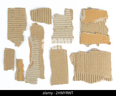 Pieces of torn brown corrugated cardboard Stock Photo
