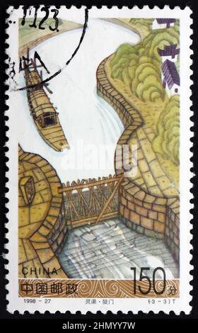 CHINA, PEOPLE’S REPUBLIC OF - CIRCA 1998: a stamp printed in China shows boat approaching lock, Lingqui canal, circa 1998 Stock Photo