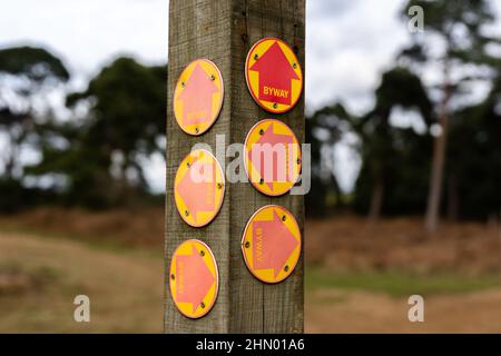A rural countryside signpost with multiple byway signs showing public byways in every direction Stock Photo