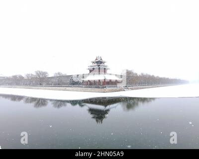 Beijing, China. 13th Feb, 2022. Photo taken on Feb. 13, 2022 shows the snow view of a turret of the Palace Museum, also known as the Forbidden City, in Beijing, capital of China. A snowfall hit Beijing on Sunday. Credit: Ding Hongfa/Xinhua/Alamy Live News Stock Photo