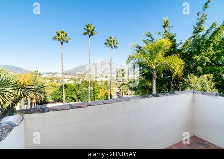 a view from a villa balcony overlooking the mountain peaks surrounding Marbella Stock Photo