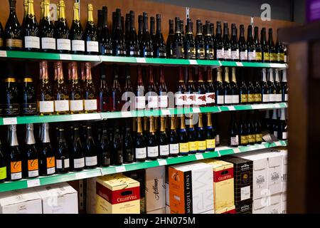 Rows of bottles with traditional spanish sparkling wine cava Stock Photo