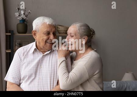 Happy laughing older married couple talking, laughing Stock Photo