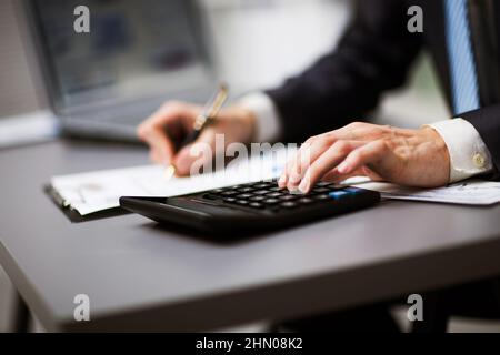 Man doing his accounting, financial adviser working Stock Photo