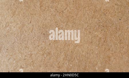 Macro shot of kraft paper as background in beige color Stock Photo