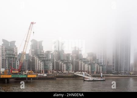 Waterfront development on the River Thames. Images taken from Vauxhall Bridge on a very damp and misty morning. Stock Photo
