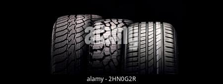 new mud tire for off-road cars SUV close-up tread on black background. Stock Photo