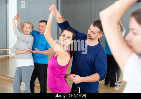 Young couple practicing active dance in pair Stock Photo