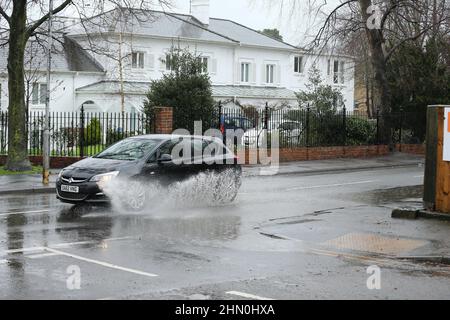 Cheltenham, UK, 13th February, 2022. UK Weather.Heavy rain creating big puddles on the roads for drivers. Credit: Gary Learmonth / Alamy Live News Stock Photo