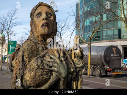Statues from the Famine Memorial on Custom House Quay alongside the River Liffey in the Dublin Docklands, Ireland. Stock Photo