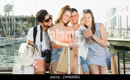 Group of friends travellers smiling and making selfie Stock Photo