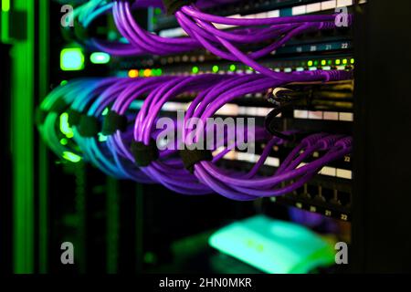 Data Cabinet Cables RJ45 Patch Cables and lights Stock Photo