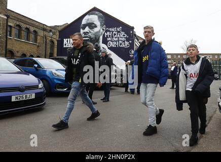 London, UK. 13th Feb, 2022. Fans walk past a mural of past Tottenham player, Ledley King near the stadium ahead of the Premier League match at the Tottenham Hotspur Stadium, London. Picture credit should read: Paul Terry/Sportimage Credit: Sportimage/Alamy Live News Credit: Sportimage/Alamy Live News Stock Photo