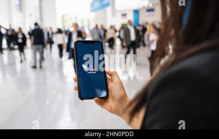 Hand Holding Iphone Xs with FaceApp on the screen, faceapp is a popular ...