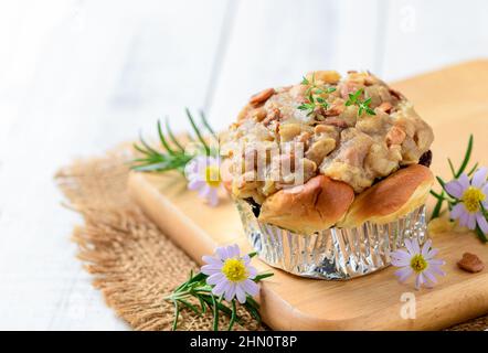 Butterscotch Bread with nuts on top on wood plated and white wood background, Homemade bakery concept Stock Photo