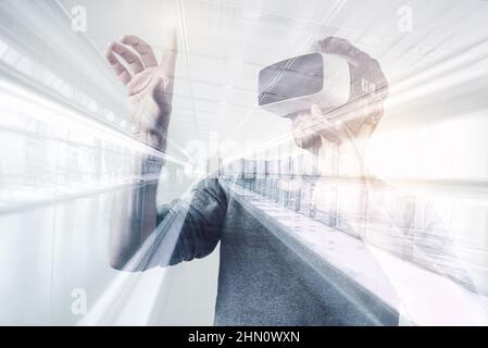 young man using a virtual reality headset - futuristic concept image Stock Photo