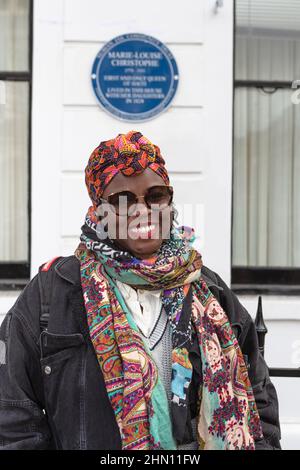 Marylebone, London, UK 7th February 2022. A guest poses in front of the unveiled Blue Plaque for the 1st and only Queen of Haiti who lived in London Stock Photo