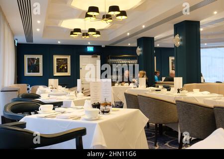 Buxton Crescent Ensana Hotel, Georgian building reopened in 2020 as luxury hotel and spa after years of restoration. Dining room set for breakfast. Stock Photo