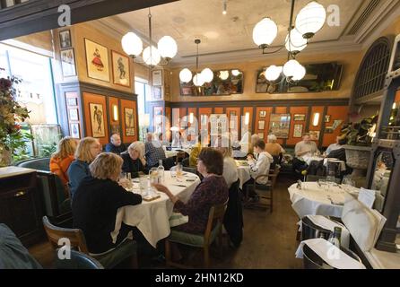 The Ivy Restaurant London; people eating a meal in the Ivy restaurant interior, Henrietta Street, Covent Garden London UK Stock Photo