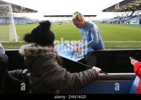 Manchester, UK. 13th Feb, 2022. Alex Greenwood of Manchester City signs a fans flag following the The FA Women's Super League match at the Academy Stadium, Manchester. Picture credit should read: Isaac Parkin/Sportimage Credit: Sportimage/Alamy Live News