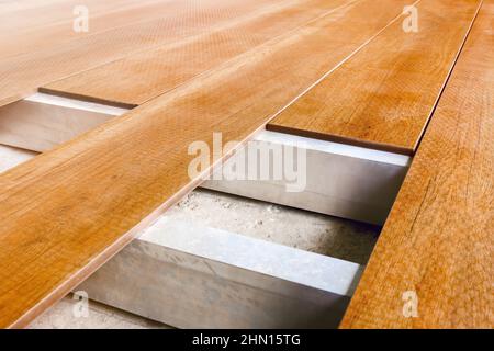 Construction floor installation wooden work flooring wood plank. Repair floor covering. Repair house deck floor renovation home. Timber decking wood Stock Photo