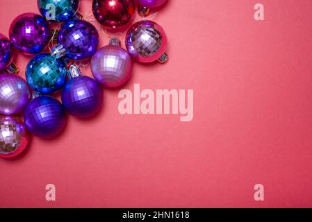 Christmas composition. Christmas red decorations, Christmas tree toys on a red background. Flat layout, top view, copy space Stock Photo