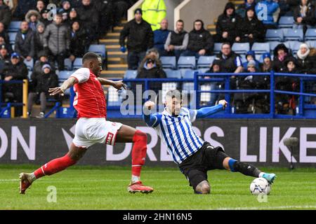 Sheffield, UK. 13th Feb, 2022. Callum Paterson #13 of Sheffield Wednesday attempts to cross the ball in Sheffield, United Kingdom on 2/13/2022. (Photo by Simon Whitehead/News Images/Sipa USA) Credit: Sipa USA/Alamy Live News Stock Photo