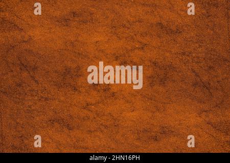 Saturated orange color old cement plaster wall with spots and grunge texture for background Stock Photo