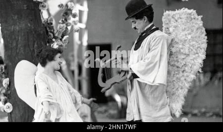 THE KID 1921 First National film with Charlie Chaplin and Lita Grey as the flirtatious angel inn the Dreamland scene. Stock Photo