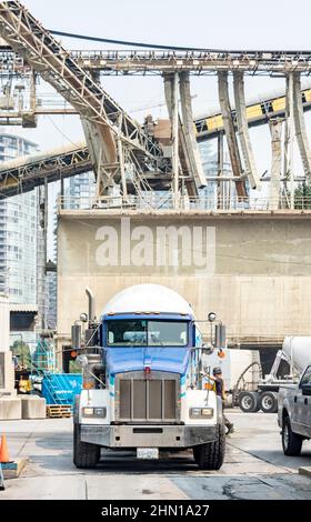 cement mixer trucks at cement works on Granville island Vancouver British Columbia canada Stock Photo