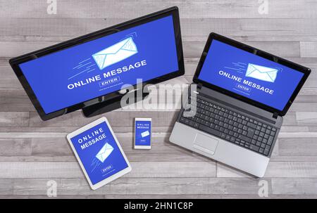 Online message concept shown on different information technology devices Stock Photo
