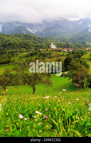 San Fermin Church in the mountain village of Drežnica, beautiful panoramic view, Slovenia Stock Photo