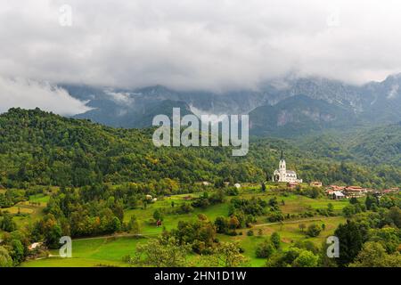 San Fermin Church in the mountain village of Drežnica, beautiful panoramic view, Slovenia Stock Photo