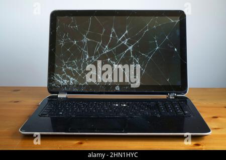 A laptop computer with broken screen. Stock Photo
