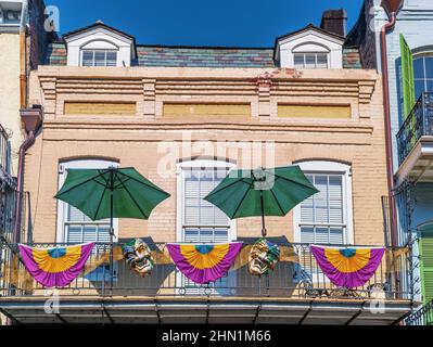 New Orleans French Quarter balcony during Mardi Gras, New Orleans, Louisiana, USA. Stock Photo