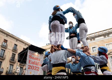 Spain. 13th Feb, 2022. Traditional Castellers performances are held on occasion of the Saint Eulalia celebrations in Sant Jaume Square in Barcelona, Spain on February 13, 2022. The Castellers are traditional catalan human towers dating back to the 18th century, normally created during festivities and celebration in the spanish region of Catalonia. (Photo by Davide Bonaldo/Sipa USA) Credit: Sipa USA/Alamy Live News Stock Photo