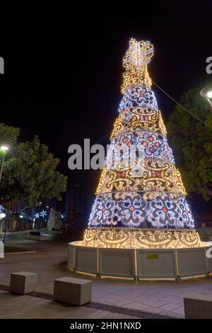 Symbolic Christmas tree made of colored lights Stock Photo