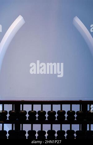 The abacus, also called a counting frame, is a calculating tool Stock Photo