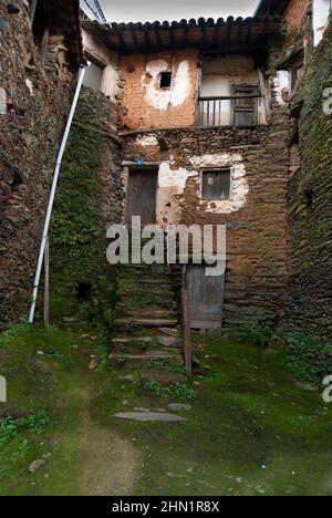 Typical corner in Robledillo de Gata, slate stone stairs and slate walls, moss Stock Photo