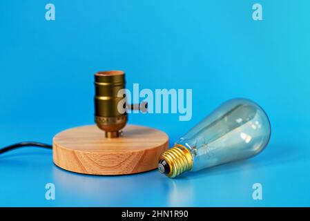 Lamp near socket. Energy saving concept. Stock Photo