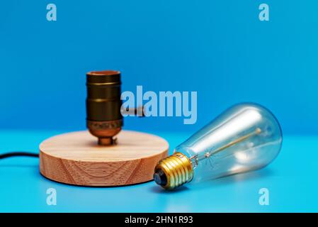 Lamp near socket. Energy saving concept. Stock Photo