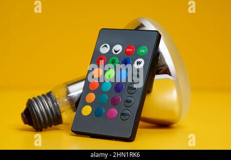 Infrared remote control for control of LED-lamp with color changing. Stock Photo