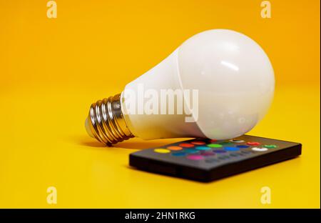 Infrared remote control for control of LED-lamp with color changing. Stock Photo