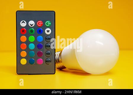 Infrared remote control for control of LED-lamp with color changing. Stock Photo