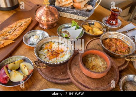 Traditional rich Turkish village breakfast on the wooden table Stock Photo