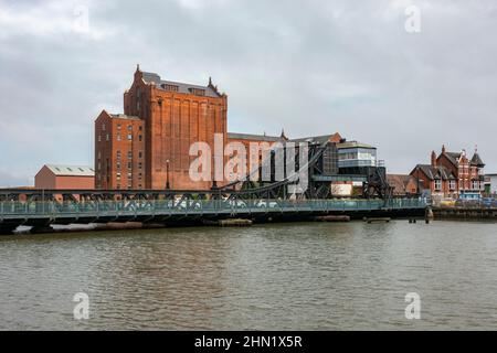 The Victoria Flour Mill with Corporation Bridge (a Scherzer rolling lift bascule bridge) in Grimsby, North East Lincolnshire, UK. Stock Photo