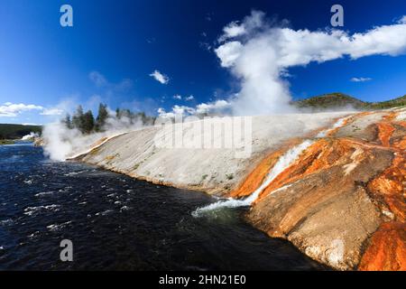 Firehole River, hot water from the Excelsior Geyser  spilling into the river, Midway Geyser Basin, Yellowstone, Wyoming, USA Stock Photo