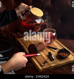 Hookah and tea stand in the cafe on the table, Copy space. The concept of a hookah bar Stock Photo