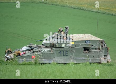 British army Warrior FV512 mechanised recovery vehicle tank in action on military exercise, Salisbury Plain, Wiltshire UK Stock Photo