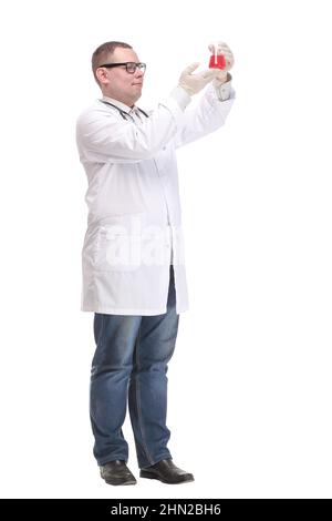 Confident man doctor wearing unifrom and glasses holding beaker Stock Photo